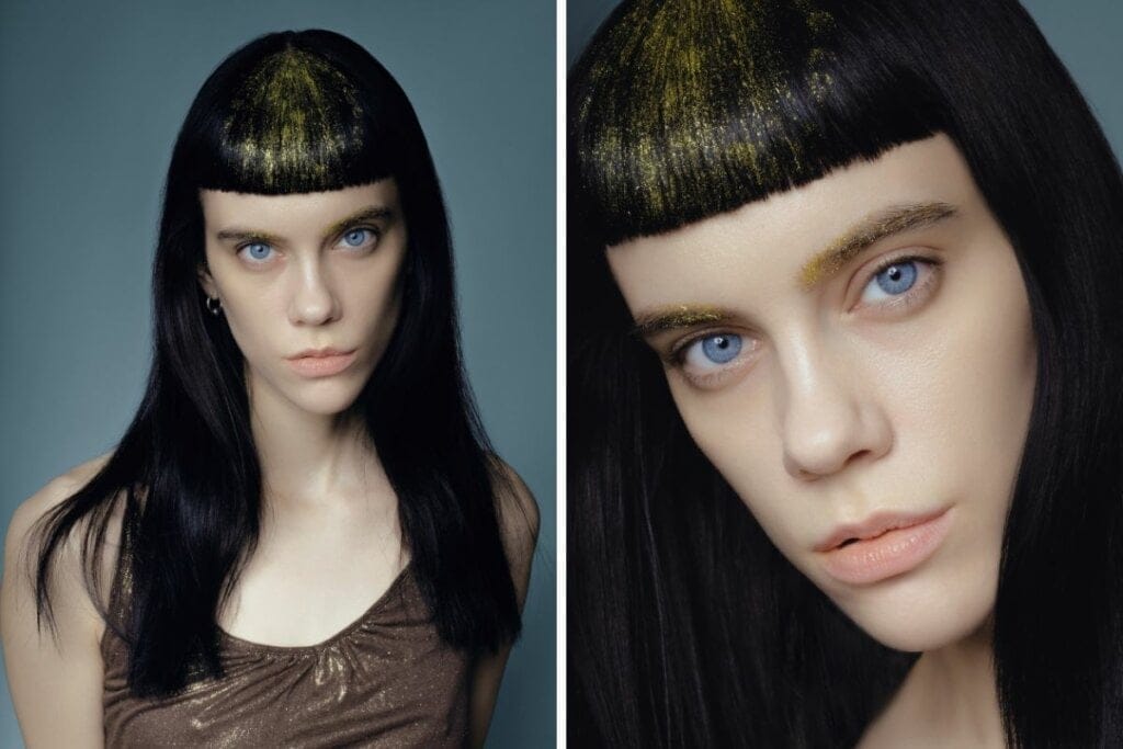 Mulher com cabelo preto e glitter dourado
