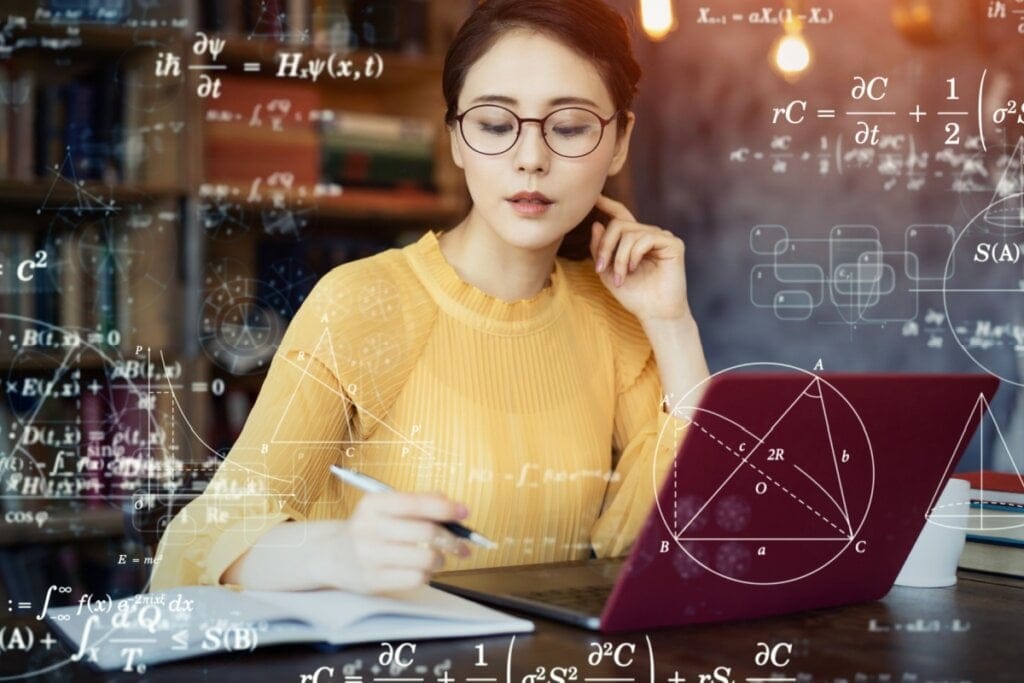Jovem de blusa amarela estudando. fórmulas de física ao fundo