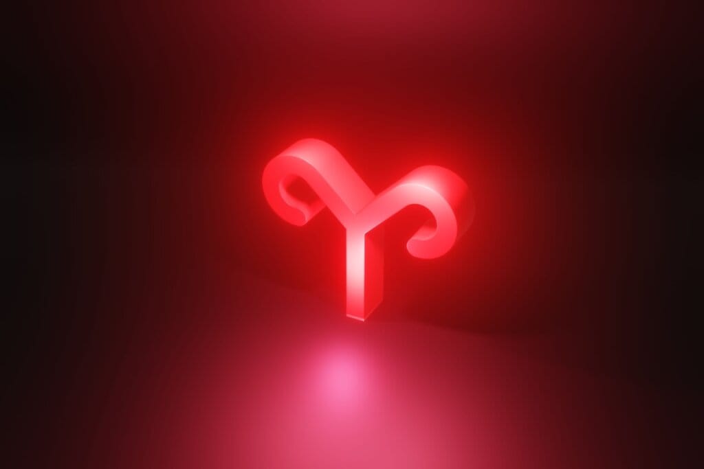 Ilustração em vermelho do símbolo do signo de Áries em fundo vermelho