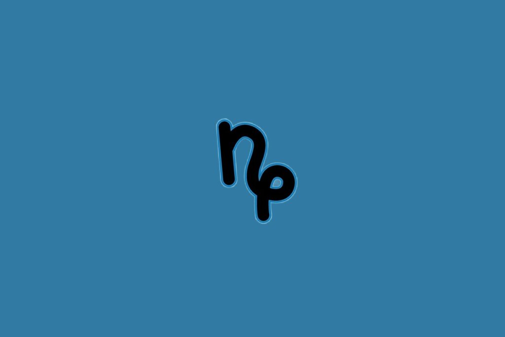 Ilustração do signo de capricórnio na cor preta sobre um fundo azul