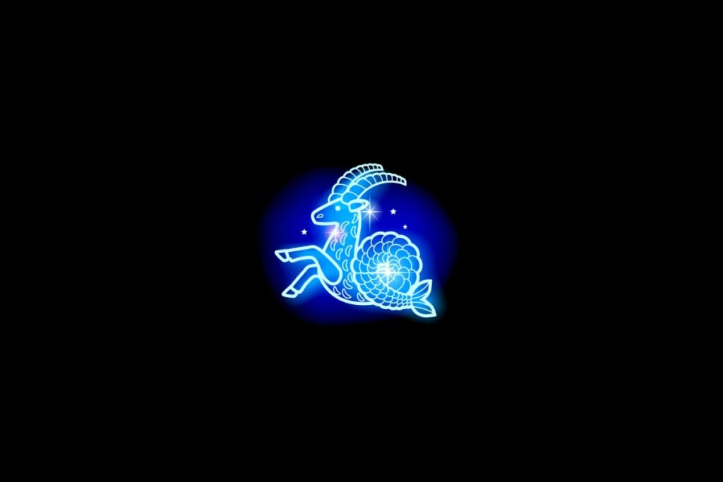 Ilustração do signo de capricórnio em azul sobre um fundo preto
