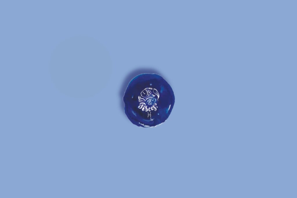 Ilustração do signo de peixes em um círculo com fundo azul e branco com estrelas