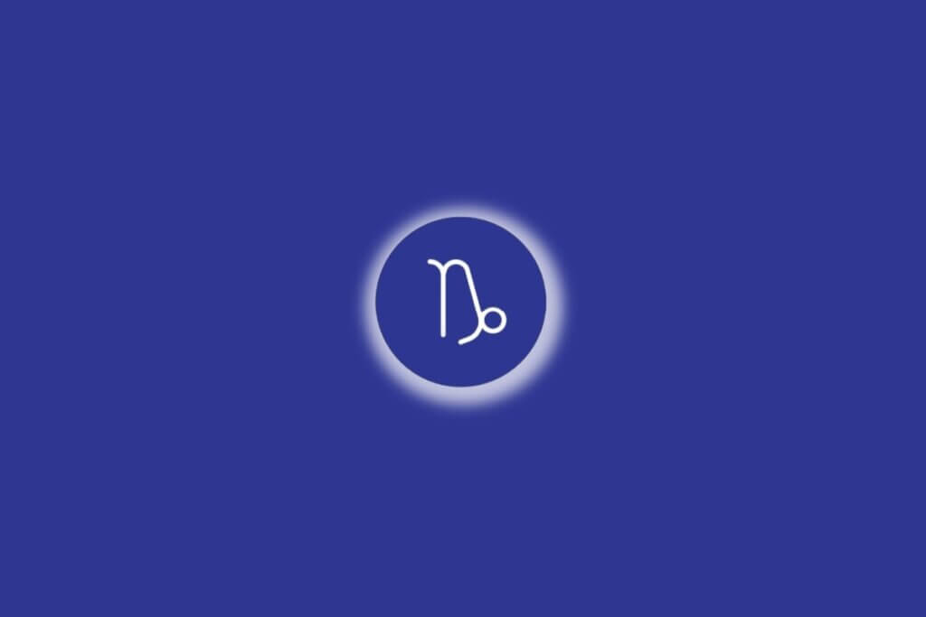 Ilustração do signo de Capricórnio em um círculo azul, com luz branca ao redor, sobre um fundo azul