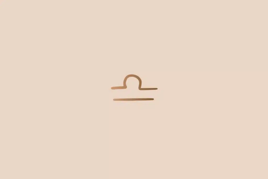Ilustração do signo de libra na cor marrom em um fundo bege-claro