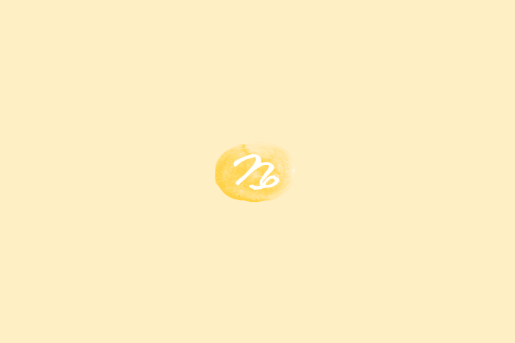 Símbolo do signo de Capricórnio em branco dentro de círculo amarelo em fundo amarelo