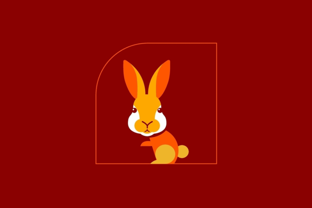 Ilustração vetorial simplificada de um coelho amarelo e laranja sobre um fundo vermelho.